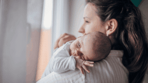mother holding newborn baby